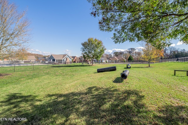 view of home's community with a lawn