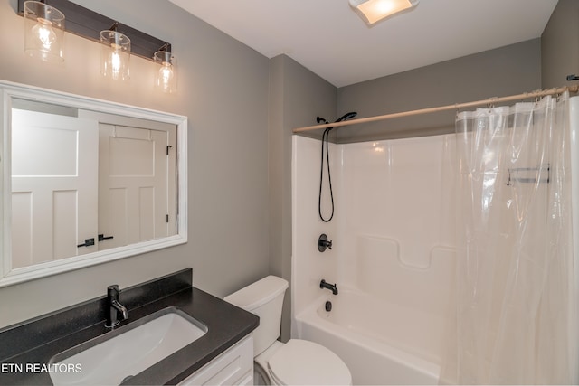 full bathroom featuring shower / tub combo, vanity, and toilet