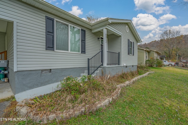 view of property exterior featuring a yard