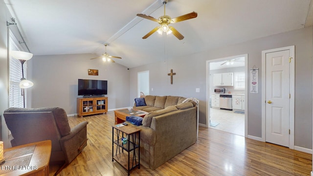 living room with ceiling fan, light hardwood / wood-style flooring, and vaulted ceiling