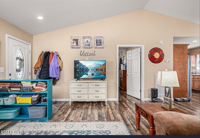 interior space featuring hardwood / wood-style floors and vaulted ceiling