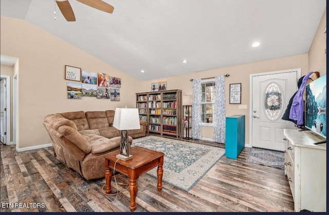 living room with wood-type flooring, lofted ceiling, and ceiling fan