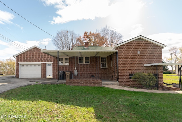 view of front of home featuring a garage and a front yard