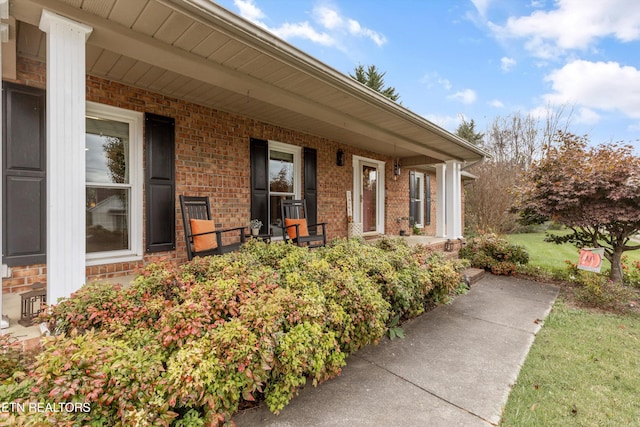 doorway to property featuring covered porch