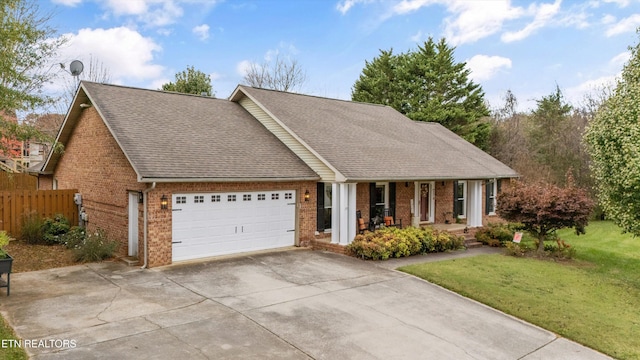 view of front facade featuring a front lawn and a garage