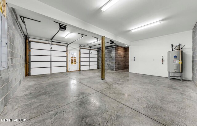 250 Clear Creek Rd, Kodak, TN 37764 - garage with electric water heater, concrete block wall, and a garage door opener