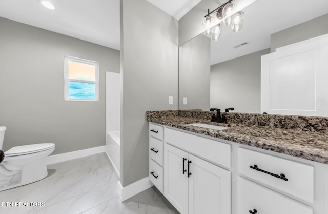 bathroom with vanity and toilet