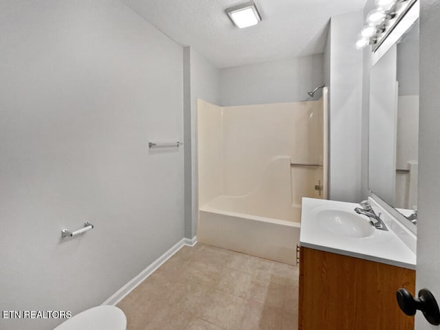 full bathroom with a textured ceiling, vanity, toilet, and  shower combination