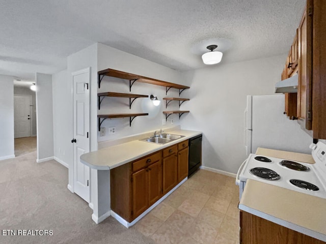 kitchen featuring a textured ceiling, sink, and white appliances