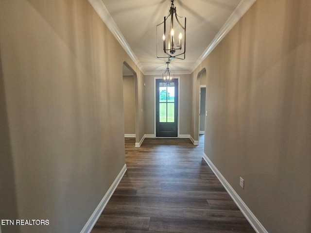 entryway with dark hardwood / wood-style flooring and ornamental molding