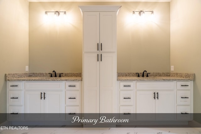 bathroom with vanity and tile patterned floors