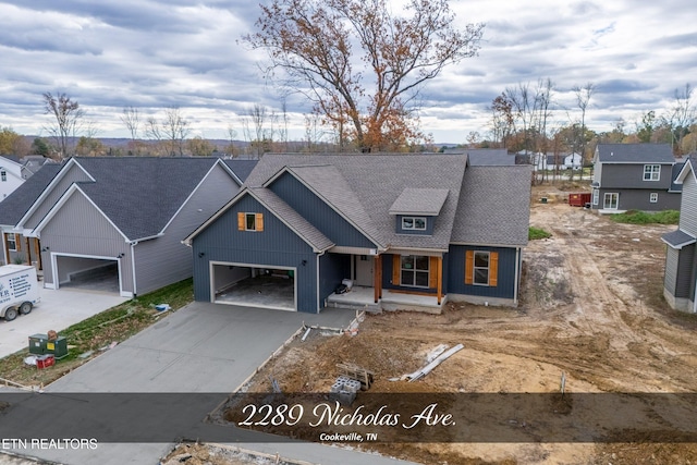 view of front of house featuring covered porch and a garage