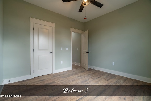 unfurnished bedroom featuring light hardwood / wood-style flooring and ceiling fan