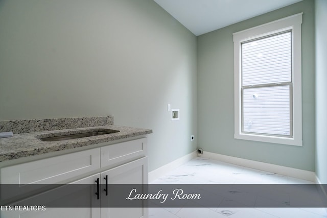 laundry area featuring electric dryer hookup, cabinets, sink, and washer hookup