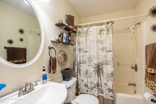 full bathroom featuring sink, shower / bathtub combination with curtain, and toilet