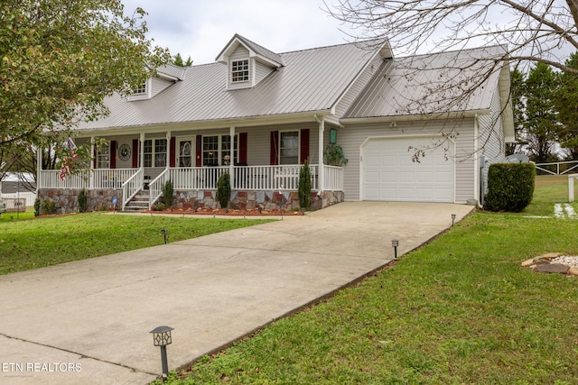 cape cod home with a front yard, a garage, and covered porch