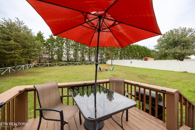 wooden deck with a yard