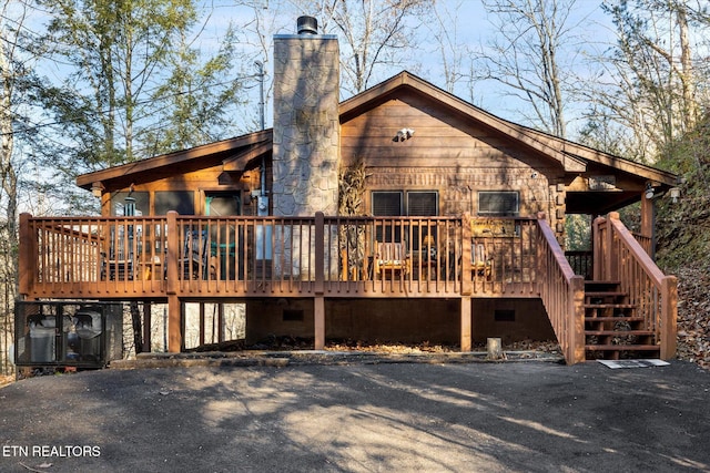 rear view of property with a deck