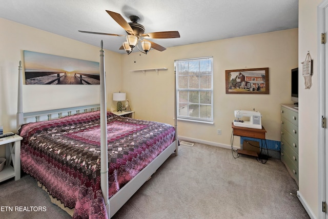 bedroom with light colored carpet and ceiling fan