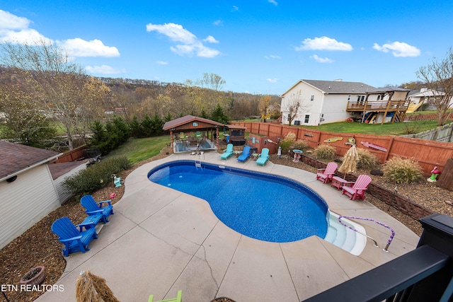 view of pool featuring a gazebo and a patio