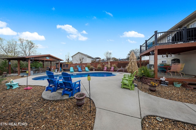 view of swimming pool with a gazebo, a patio area, and a deck