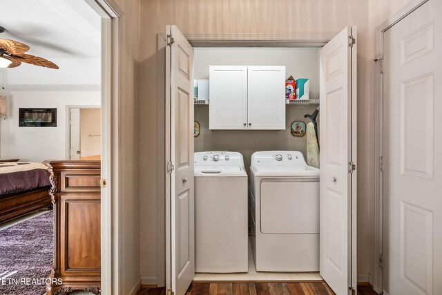 washroom with hardwood / wood-style floors, ceiling fan, cabinets, and separate washer and dryer