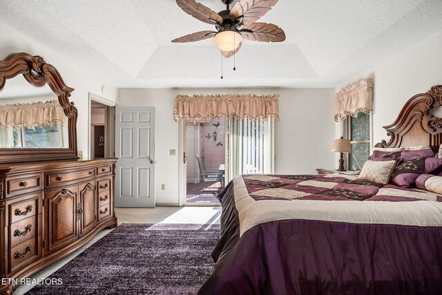 bedroom featuring ceiling fan, access to exterior, light colored carpet, and multiple windows