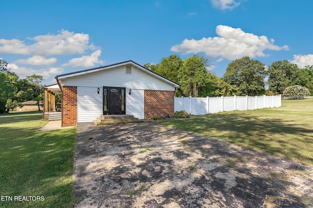 exterior space with a lawn