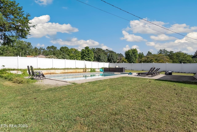 view of yard with a fenced in pool and a patio area