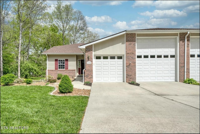 view of front of house with a front yard and a garage