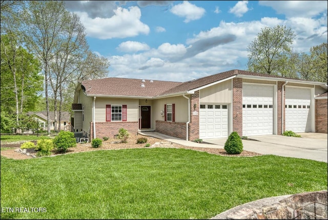 ranch-style house featuring a garage and a front lawn