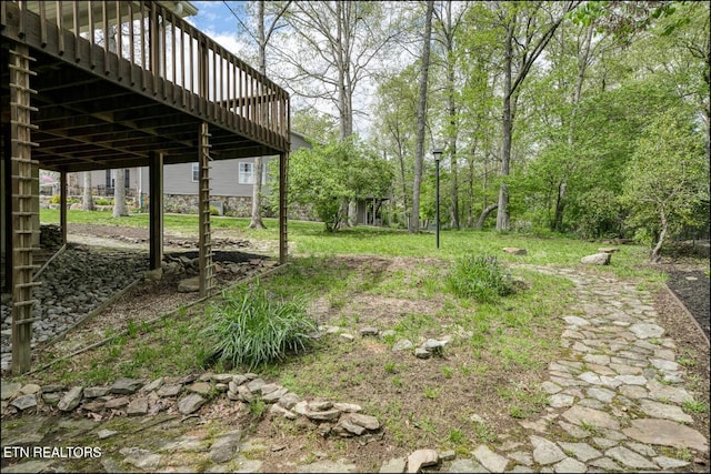 view of yard featuring a deck