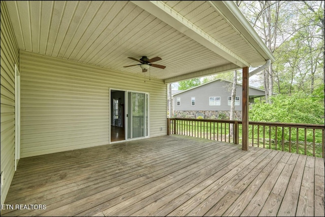 wooden terrace featuring ceiling fan