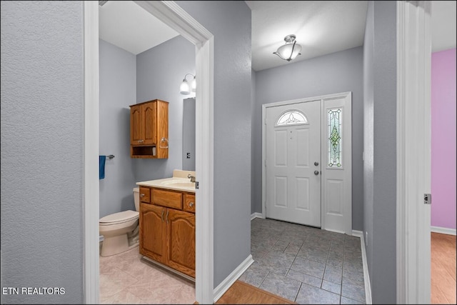 entryway featuring light wood-type flooring and sink