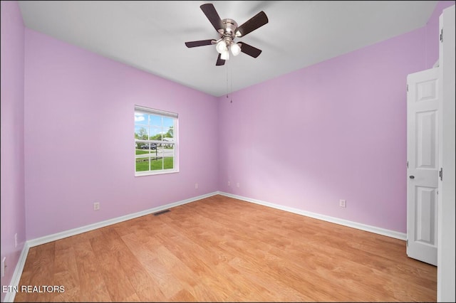 unfurnished room with ceiling fan and light hardwood / wood-style floors