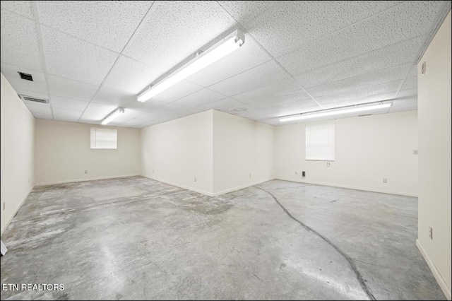 basement featuring a drop ceiling