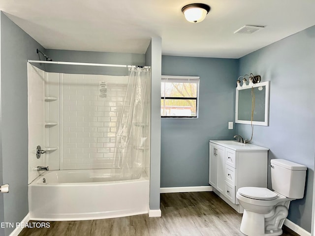 full bathroom featuring shower / bath combo, toilet, wood-type flooring, and vanity