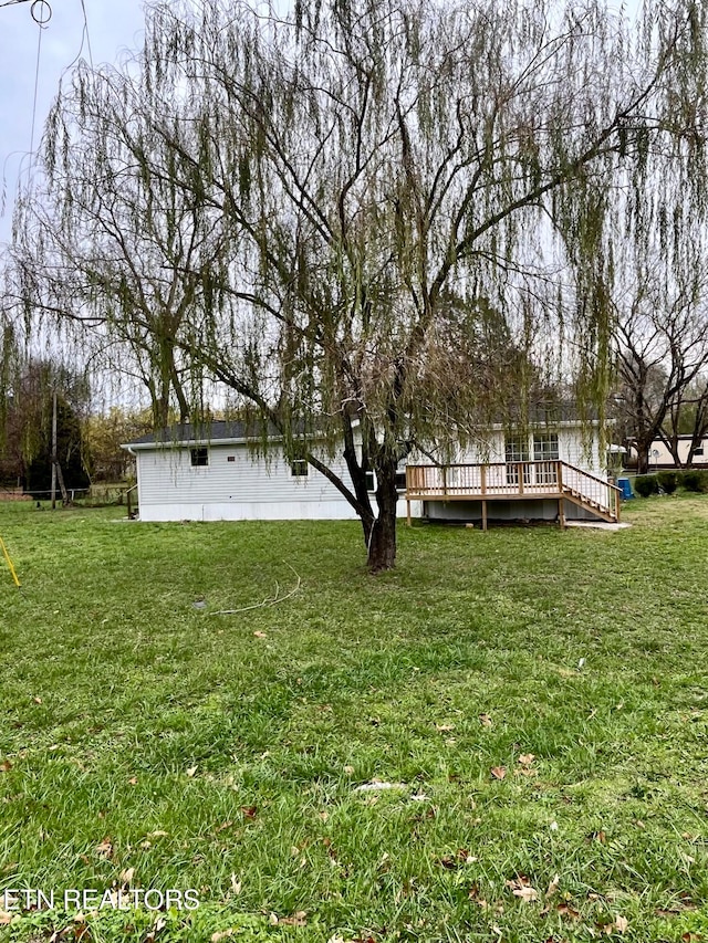 view of yard featuring a deck