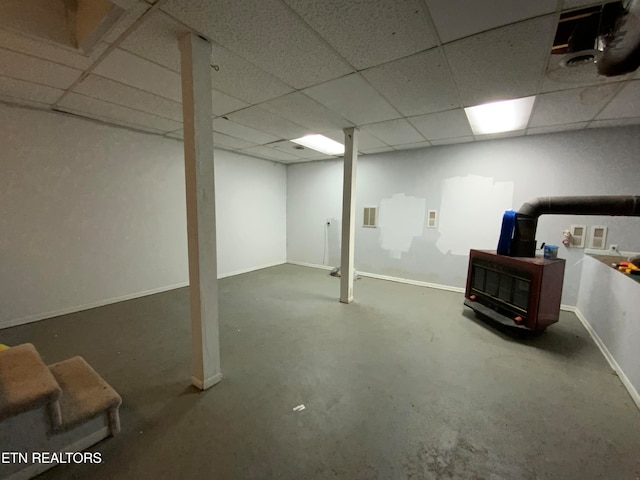 basement featuring a drop ceiling