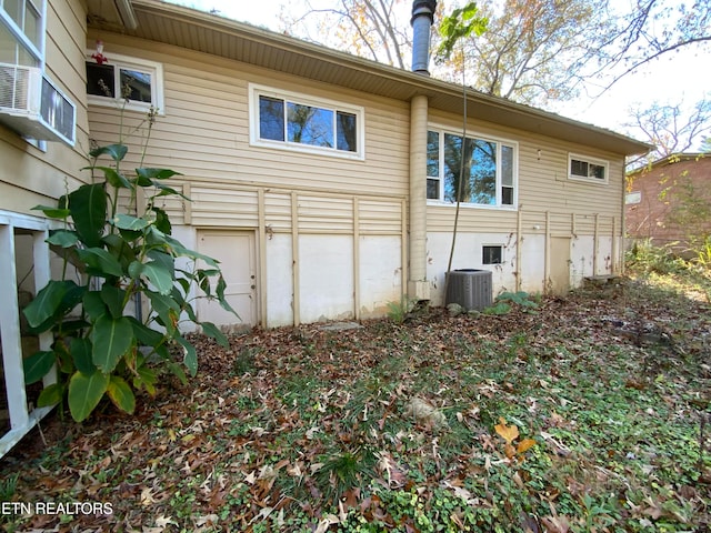 rear view of house with central air condition unit