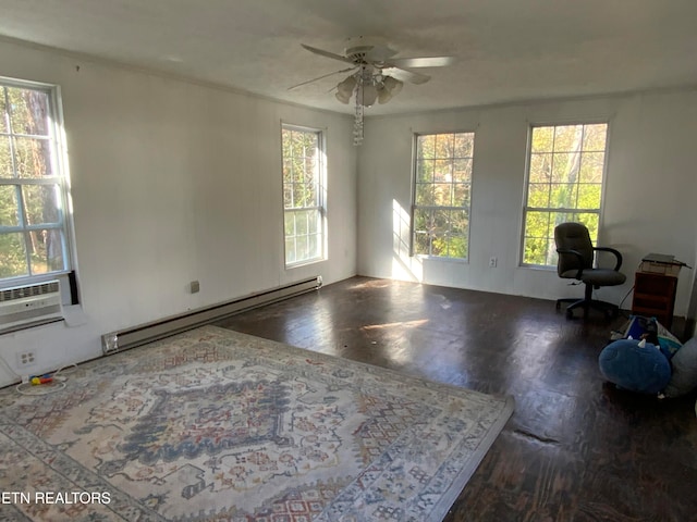 interior space featuring dark hardwood / wood-style flooring, plenty of natural light, a baseboard heating unit, and ceiling fan