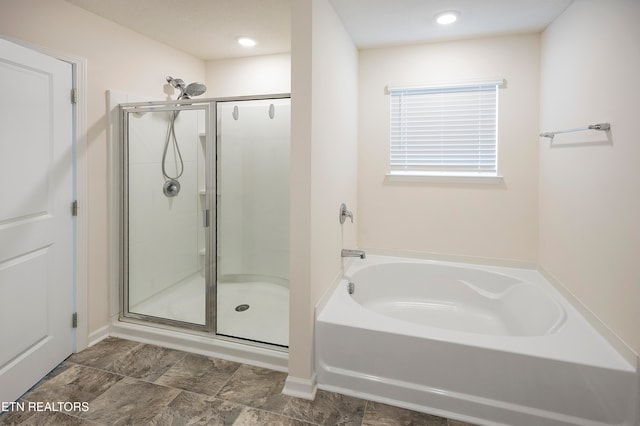 bathroom with independent shower and bath