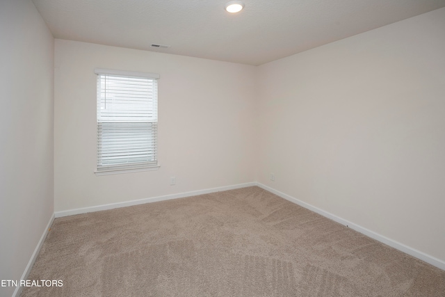 empty room featuring carpet flooring