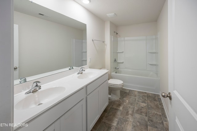 full bathroom with vanity, shower / bathing tub combination, and toilet