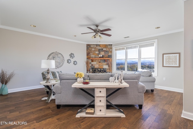 living room with ceiling fan, ornamental molding, and dark wood-type flooring