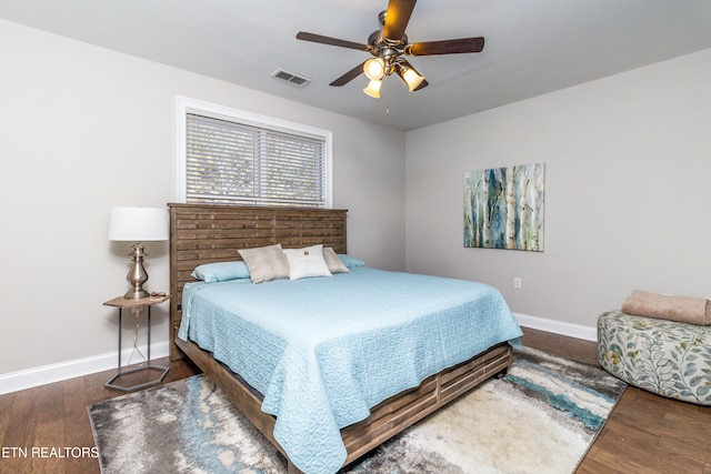 bedroom featuring ceiling fan and dark wood-type flooring