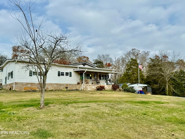 exterior space with a porch and a front lawn