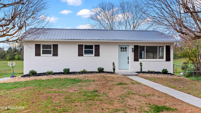 view of front of property with a front lawn