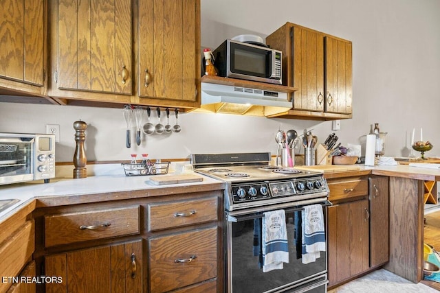 kitchen with range hood and range