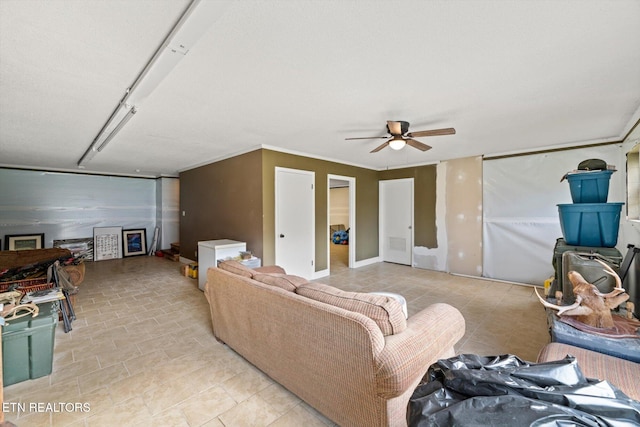 living room featuring ceiling fan and ornamental molding